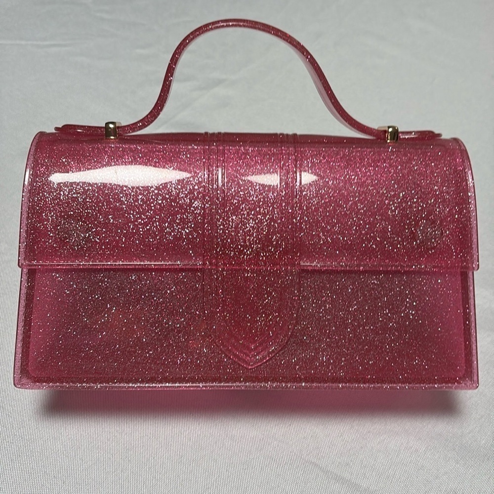 Jelly Purse, Pink Glitter comes w/strap. NWOT. Magnetic closure. Super Cute.